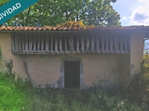 una cabaña de piedra y todo el valle por delante.